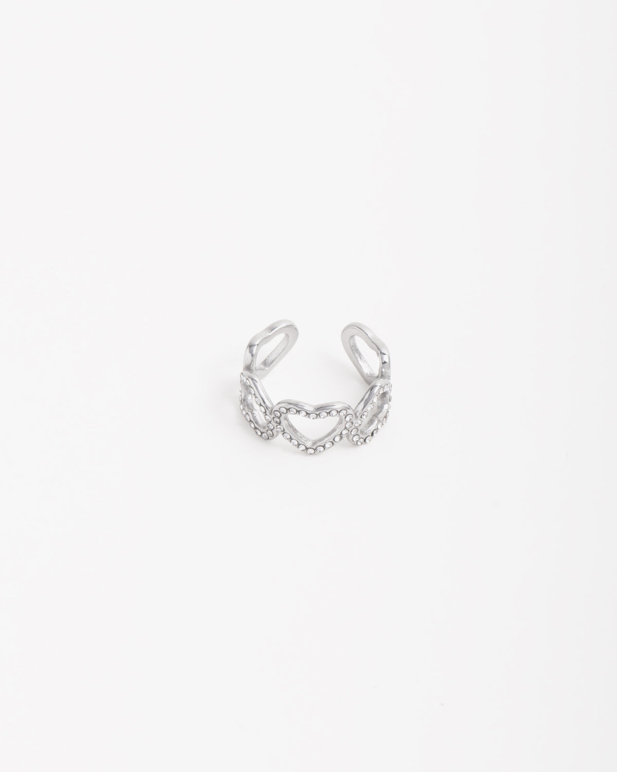 Anello Angelica in acciaio inossidabile color oro . Ha un design a fascia formato da 5 cuori: i tre centrali  hanno una fila di strass mentre i due finali sono lisci. Il verso dei cuori è alternato ed è regolabile sul retro.